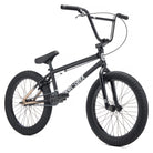 A BMX bicycle with a dark metallic purple frame, black handlebars, black seat, and black tires, photographed on a clean white background.